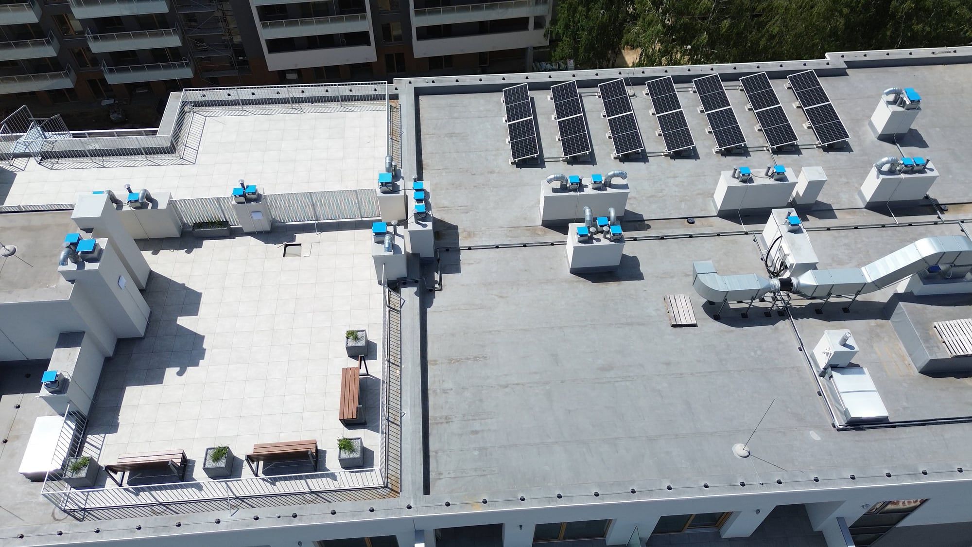 Flat commercial roof with HVAC units seen from above